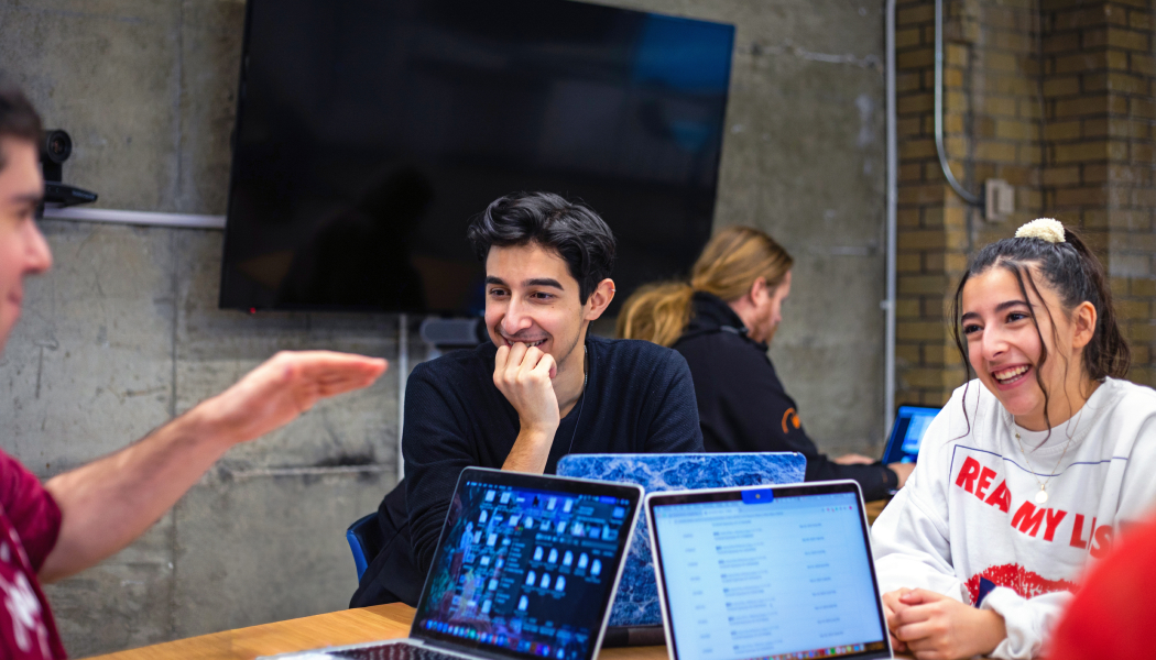 Three students working on their laptops during a Global Campus Studio session
