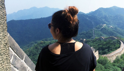 Student looking  at the landscape from a viewpoint