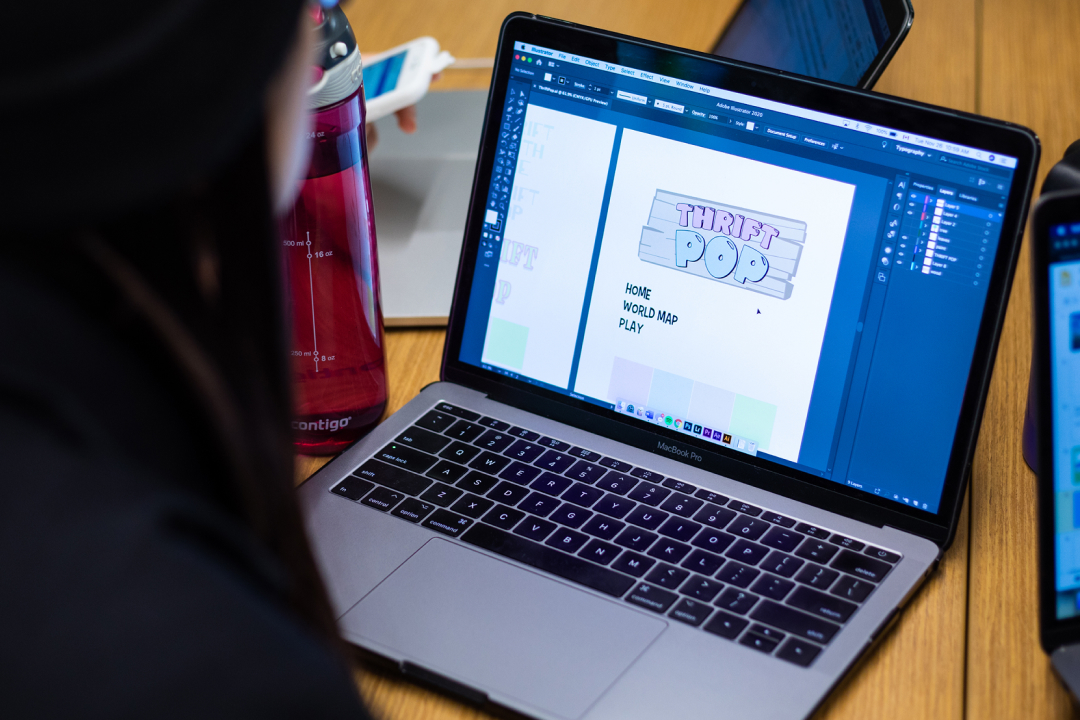 Three students working on their laptops during a Global Campus Studio session