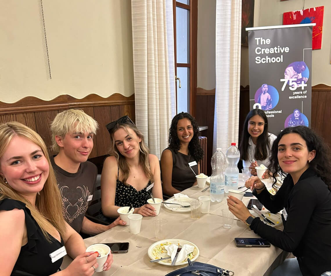 Students sitting around table at restaurant in Cortona