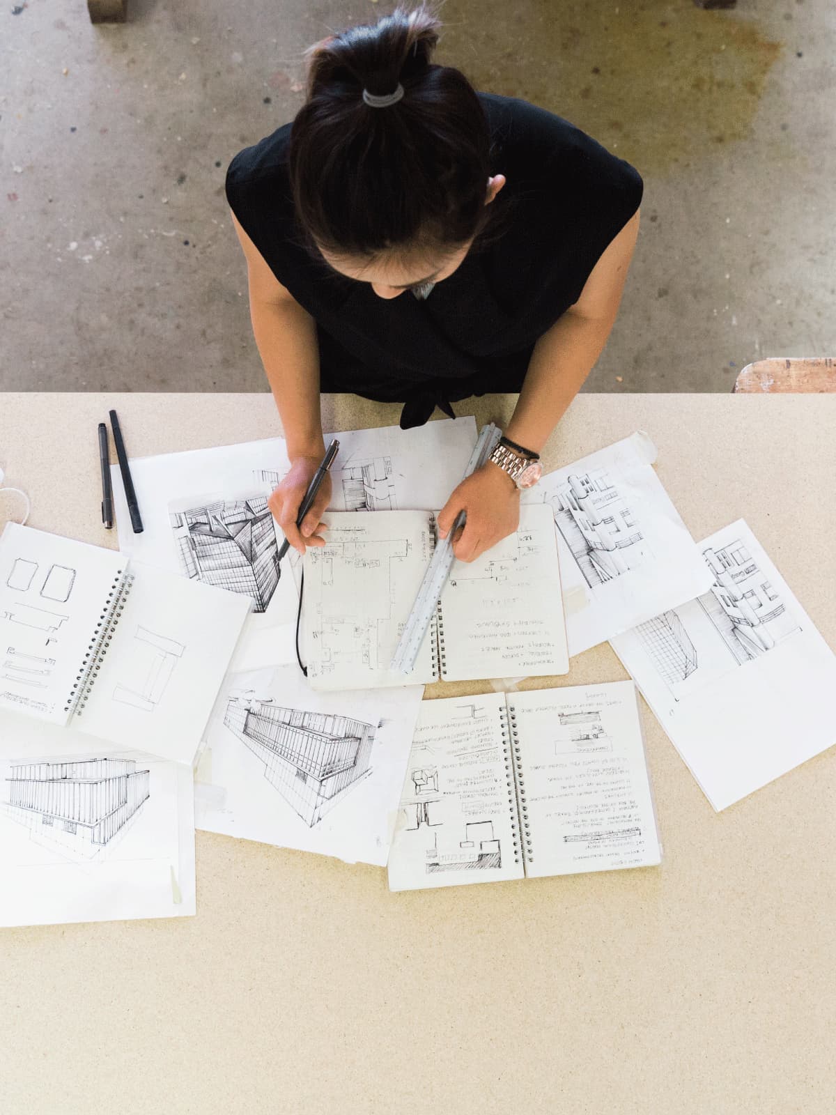Student reviewing interior design sketches