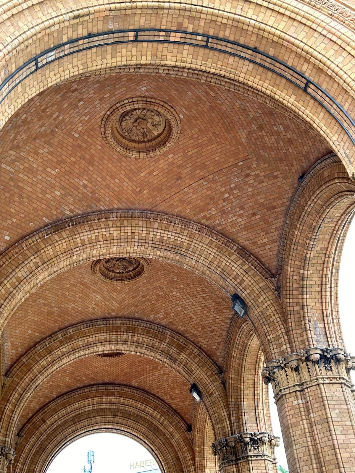 The inner arches of a historical landmark made of brick.