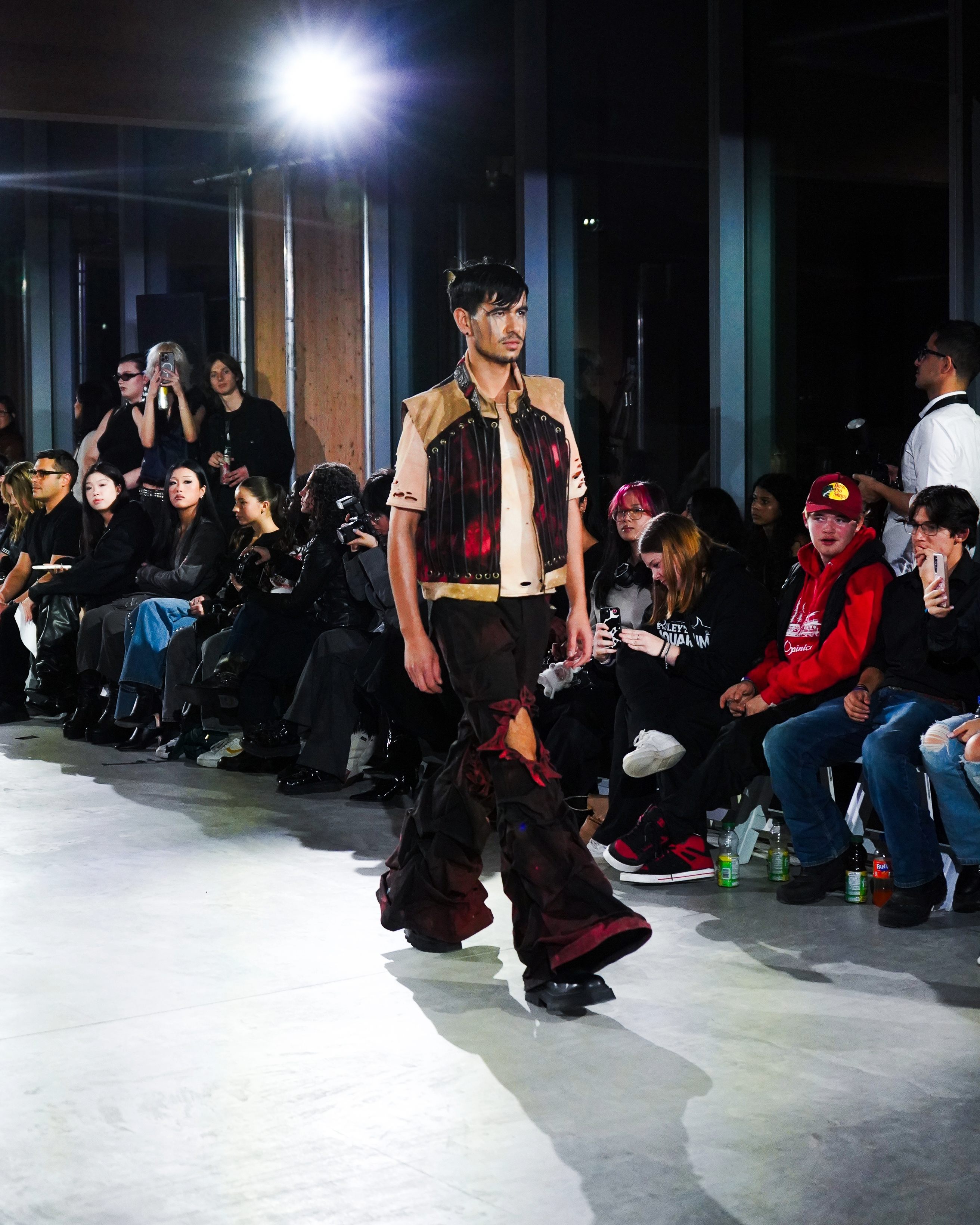A model walks down the runway wearing a coordinated two-piece set from SOLAR.