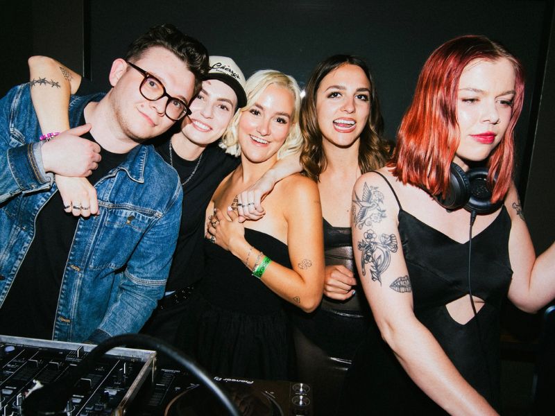 Mat Landry and The Beaches are pictured havng a good time embracing each other during a live DJ performance featuring The Beaches.