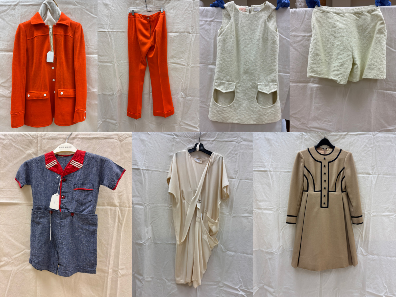 A selection of vintage garments from the FRC collection: a Courrèges orange women’s pant suit from the 1970s (top left), a pale green mini dress with matching hot pants from the 1960s (top right), a boy’s blue cotton shorts and top set from the 1950s (bottom left), a Geoffrey Beene dress from the 1960s (bottom center), and a Takezo Tokyo cream wool dress from the 1990s (bottom right).