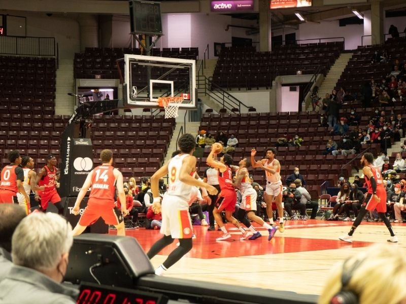 Basketball game between the Raptors 905 in red jerseys and the Skyhawks in white jerseys