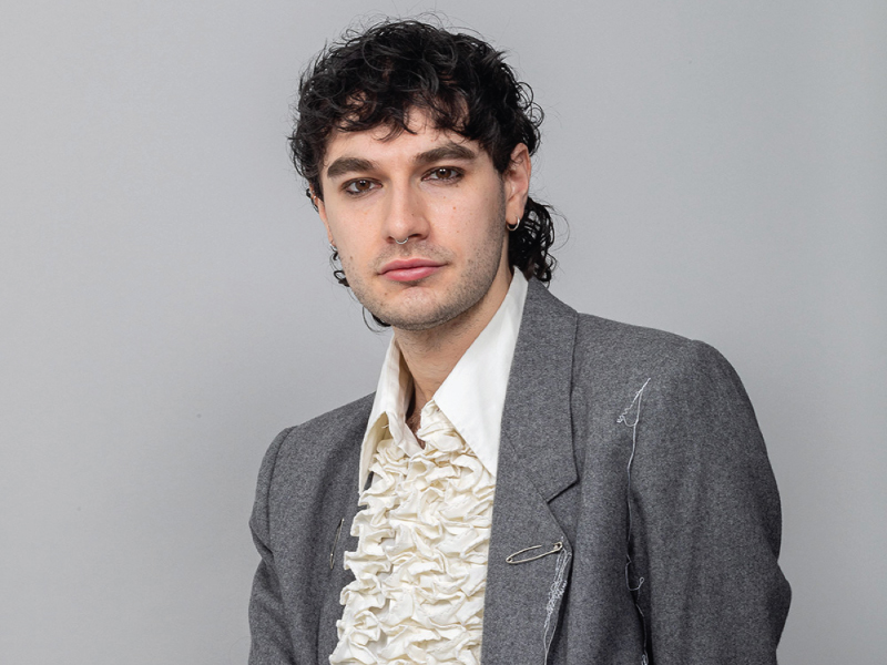 SRFI Fellow Daniel Bosco in a grey blazer and white shirt