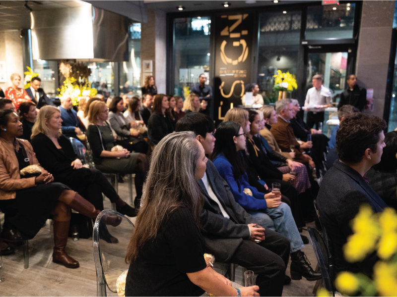 Audience sits and listens to the JennAir panel