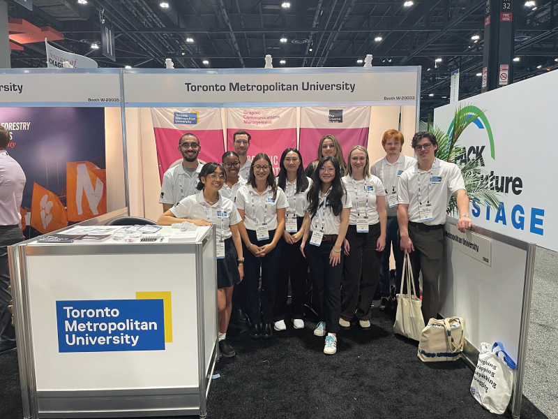 Group of Graphic Communications Management students at the TMU Exhibitors booth supported by PMMI