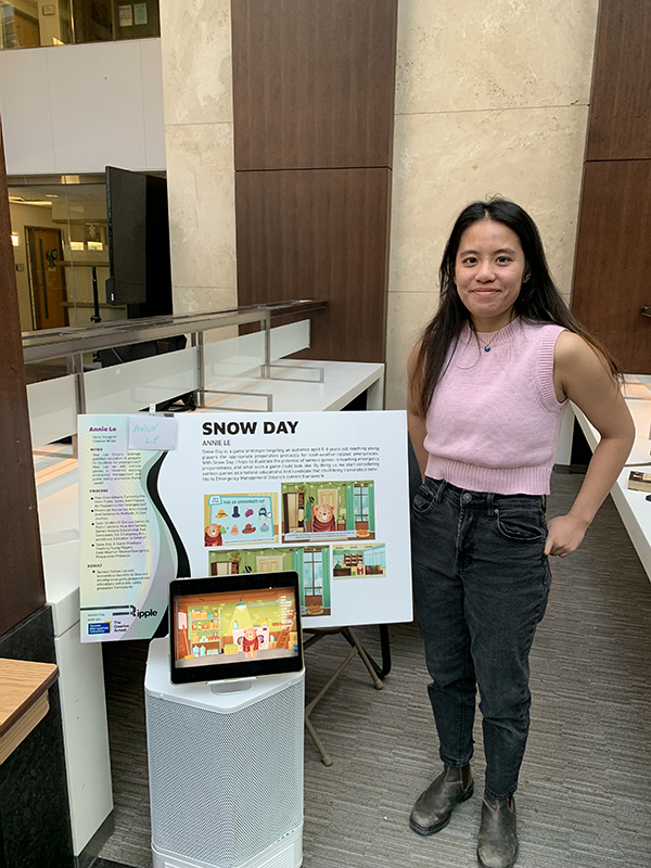 MDM candidate Annie Le with her final project, focusing on public safety education through gamificiation 