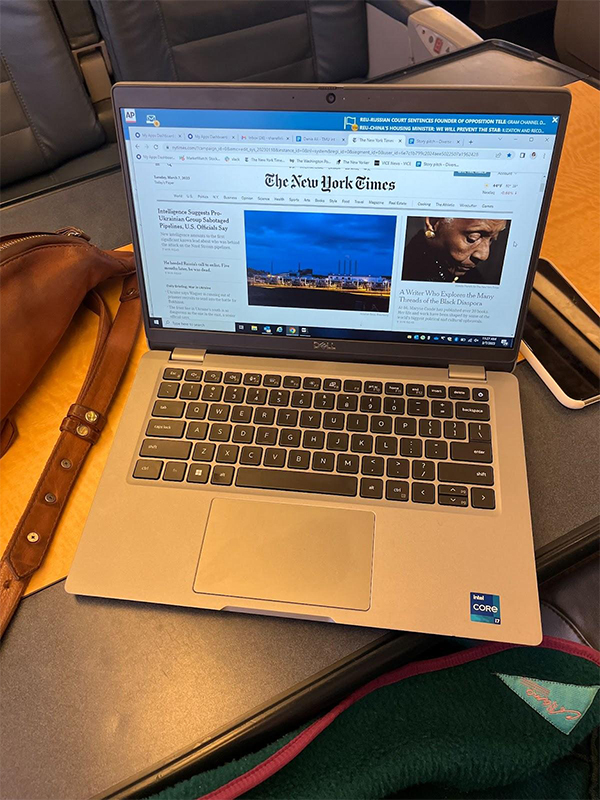 On a table in front of her seat on the train, Kaul’s laptop is open to an article by The New York Times.