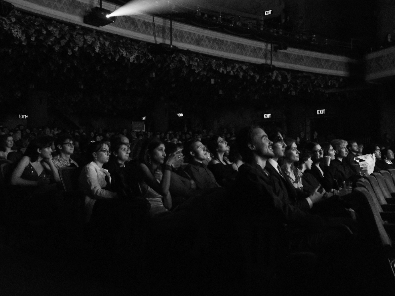 A black and white photo of the audience filling out most seats at the Winter Garden Theater. 