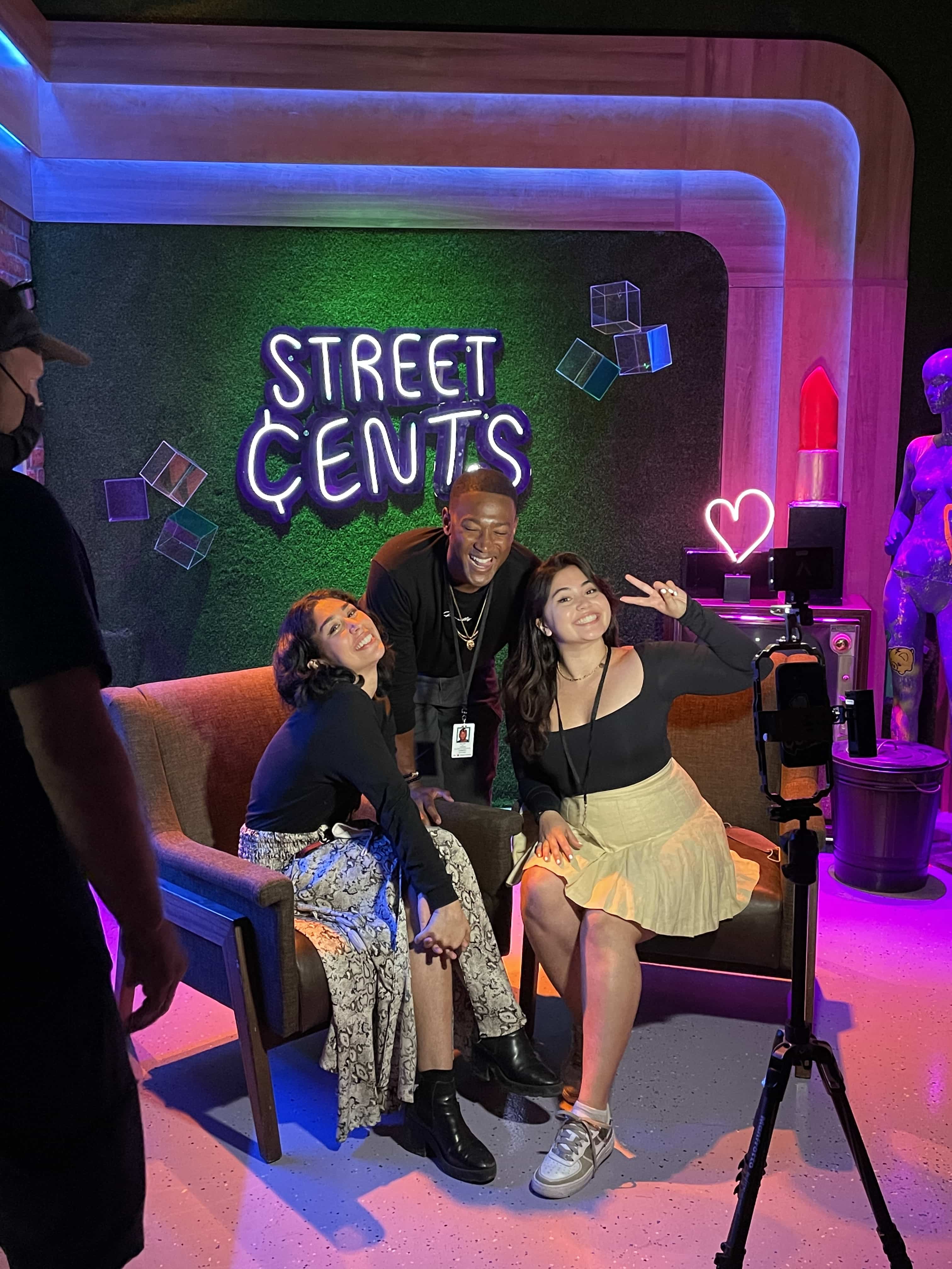 Hosts of Street Cents in the studio posing for a picture