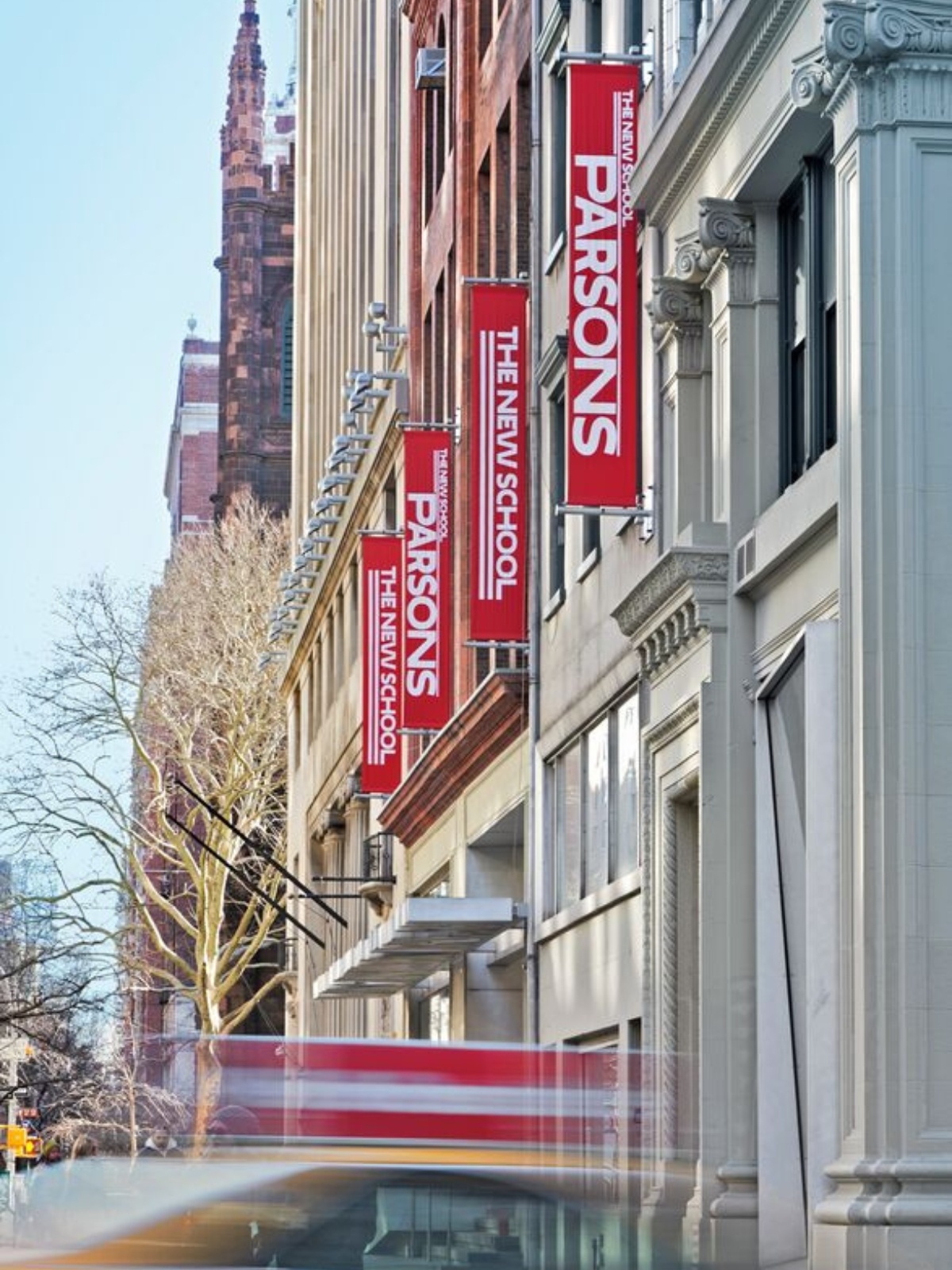 Exterior of Parsons School of Design with red banners hanging on the building