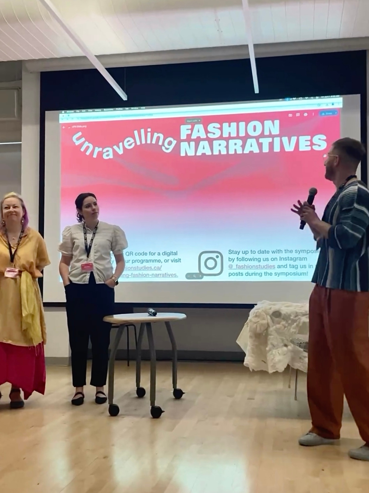 Organizers welcoming attendees and participants at Unravelling Fashion Narratives