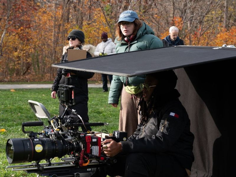 Victoria Sullivan holds a clipboard while director Chandler Levack and Director of Photography Ashley Iris Gill operate the camera while filming My Dead Mom