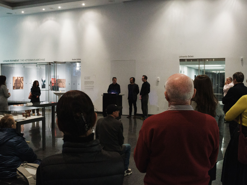 Group of people in art gallery.