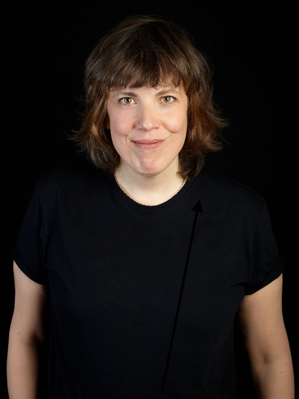  A headshot of Carolyn Taylor against a balck backdrop. 