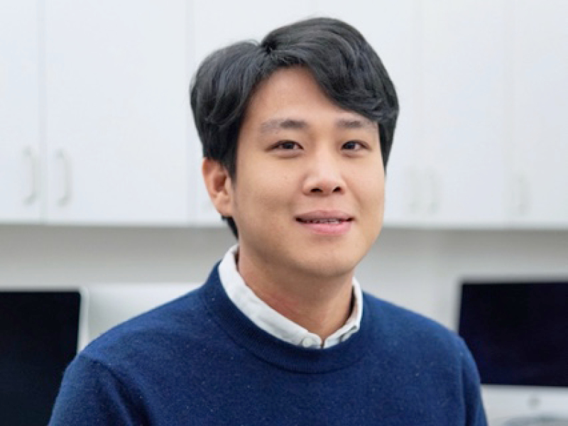 Professor Jay Park wears a navy blue sweater and looks into the camera