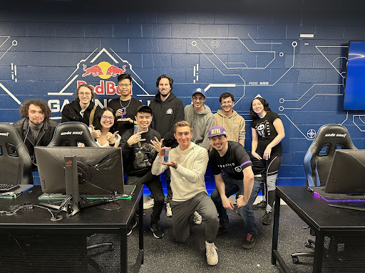 The 11 members of the LVL UP team are shown in the hub. Three individuals hold cans of Red Bull. 
