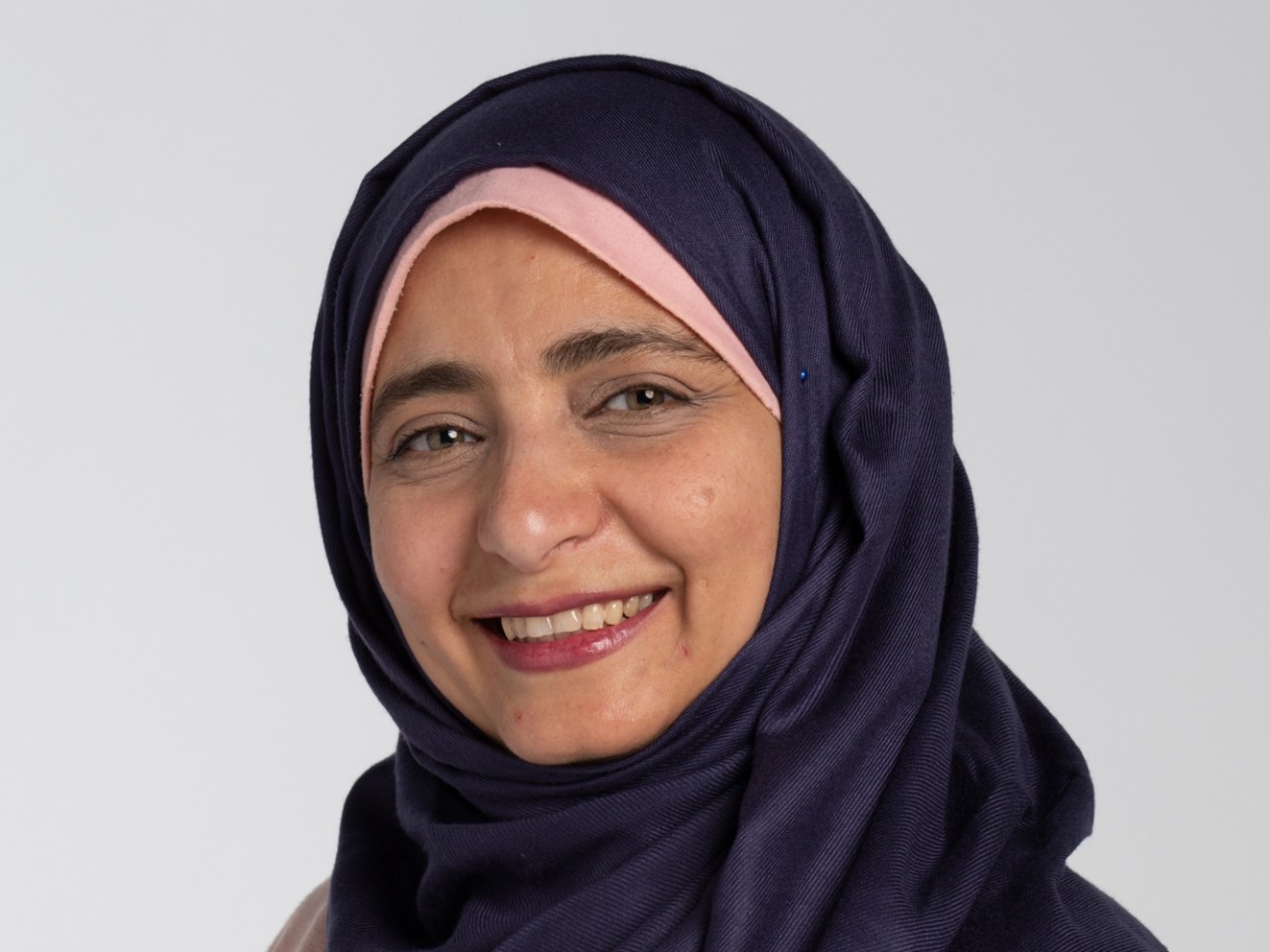 Head shot of Dr. Reem El Asaleh weaing hijab (head scarf) 