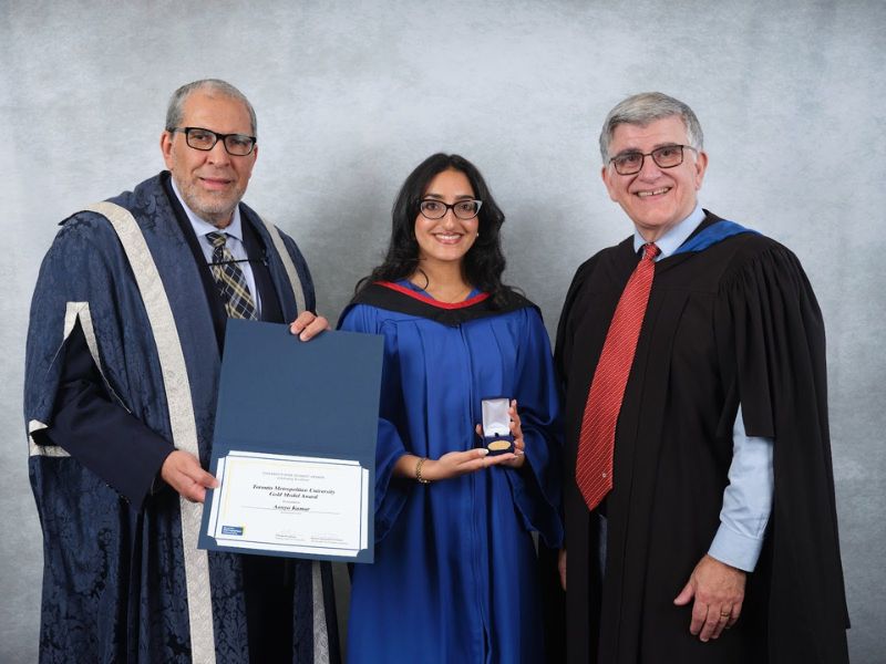 Aanya Kumar (middle) with Dr. Mohamed Lachemi, President and Vice-Chancellor of Toronto Metropolitan University (left), and Charles Falzon, Dean of The Creative School (right)