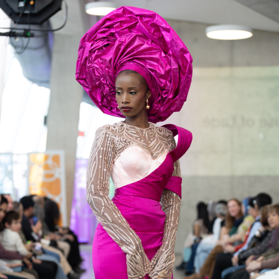 Woman walking the runaway of Mass Exodus