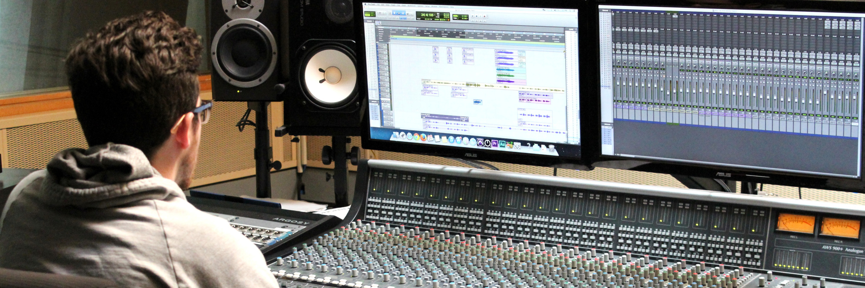 Student working in a music production facility. 