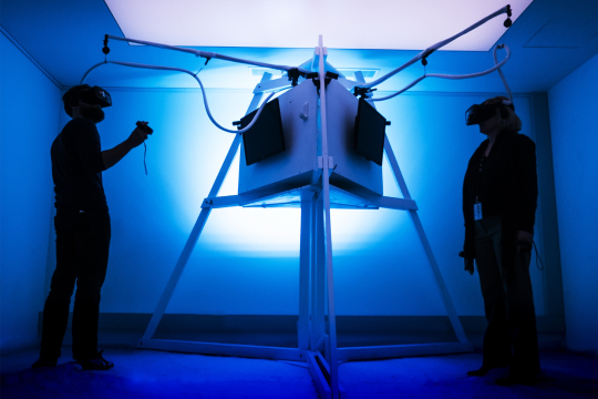 Students wearing head sets and testing a digital product