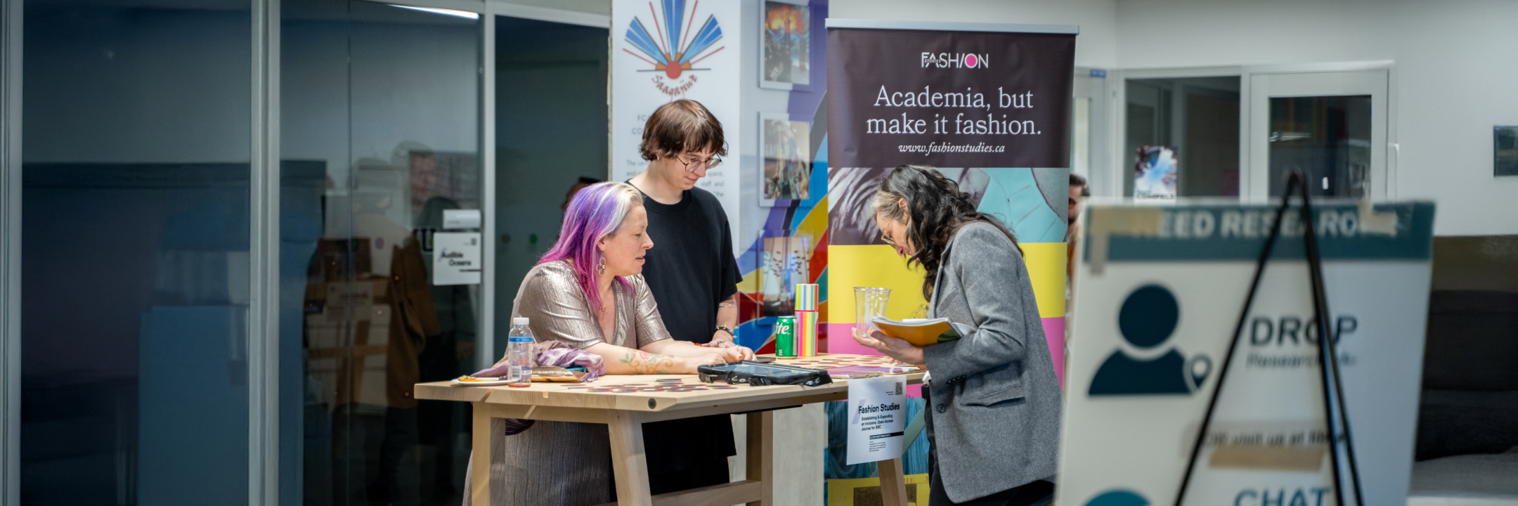 Two students working on a computer preparing a 3D printing project
