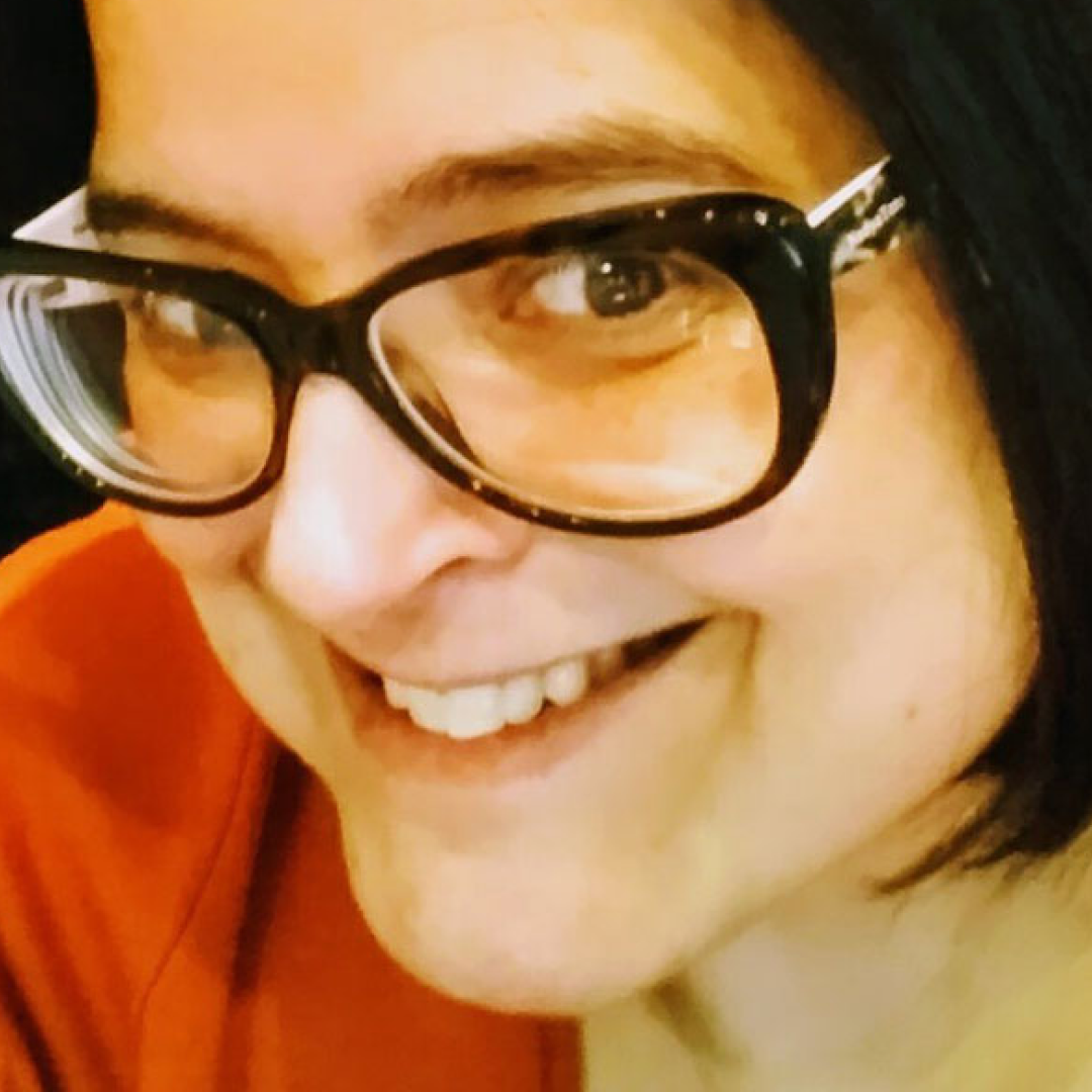 Headshot of Alanna Sanderson smiling