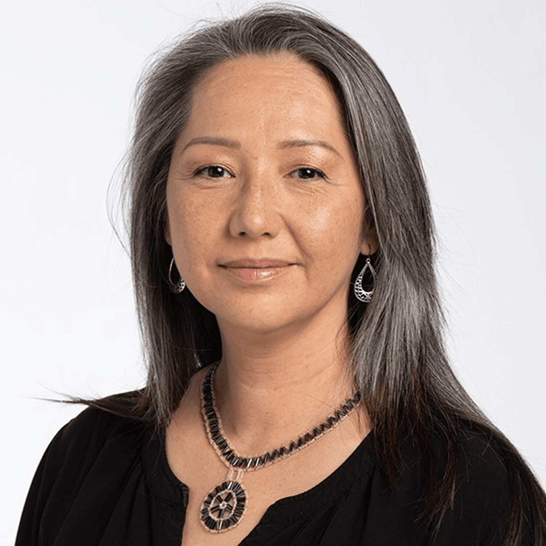 Headshot of Jeanine Webster wearing black blouse and smiling