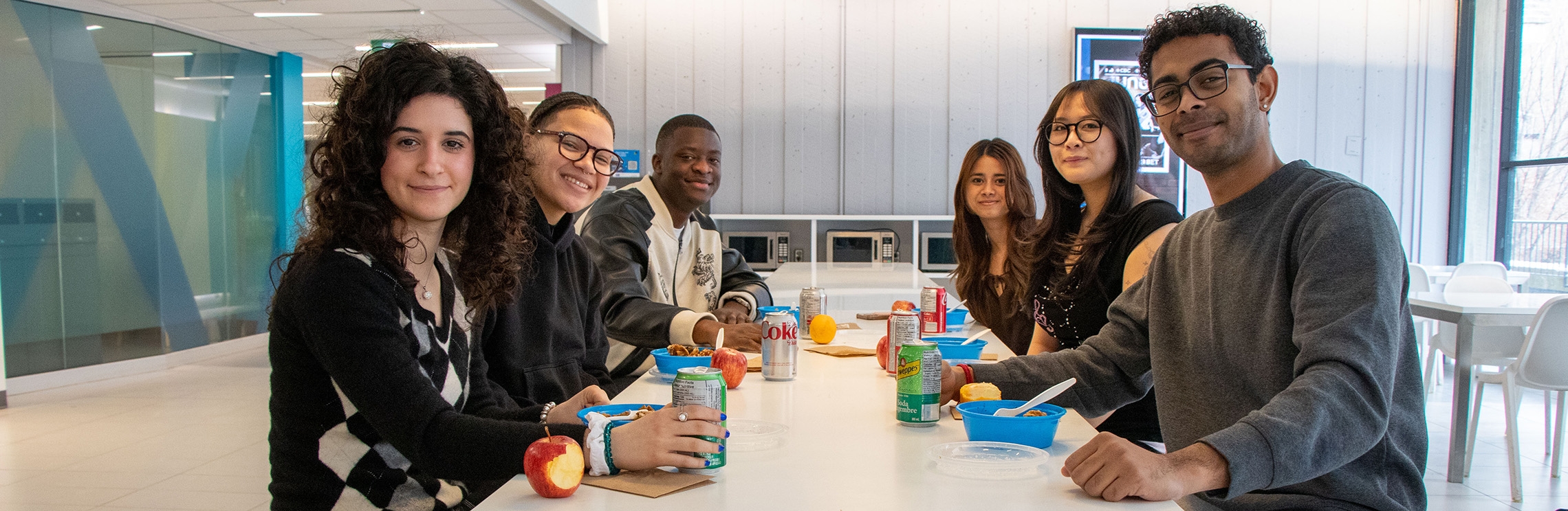 Students eating a meal they received from the Free Food Project 