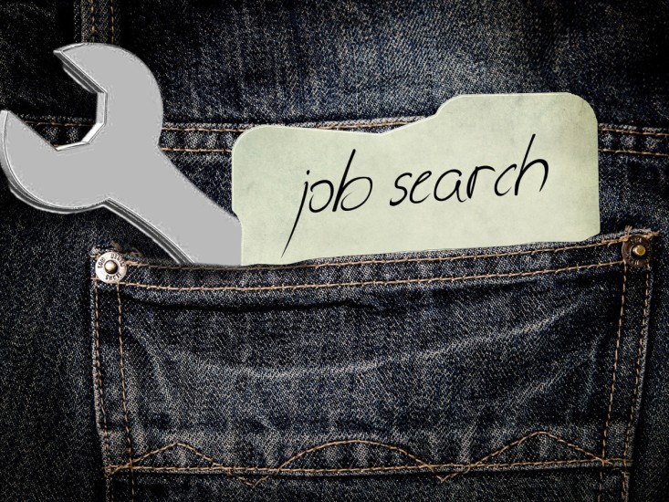job search note and a spanner in a pocket