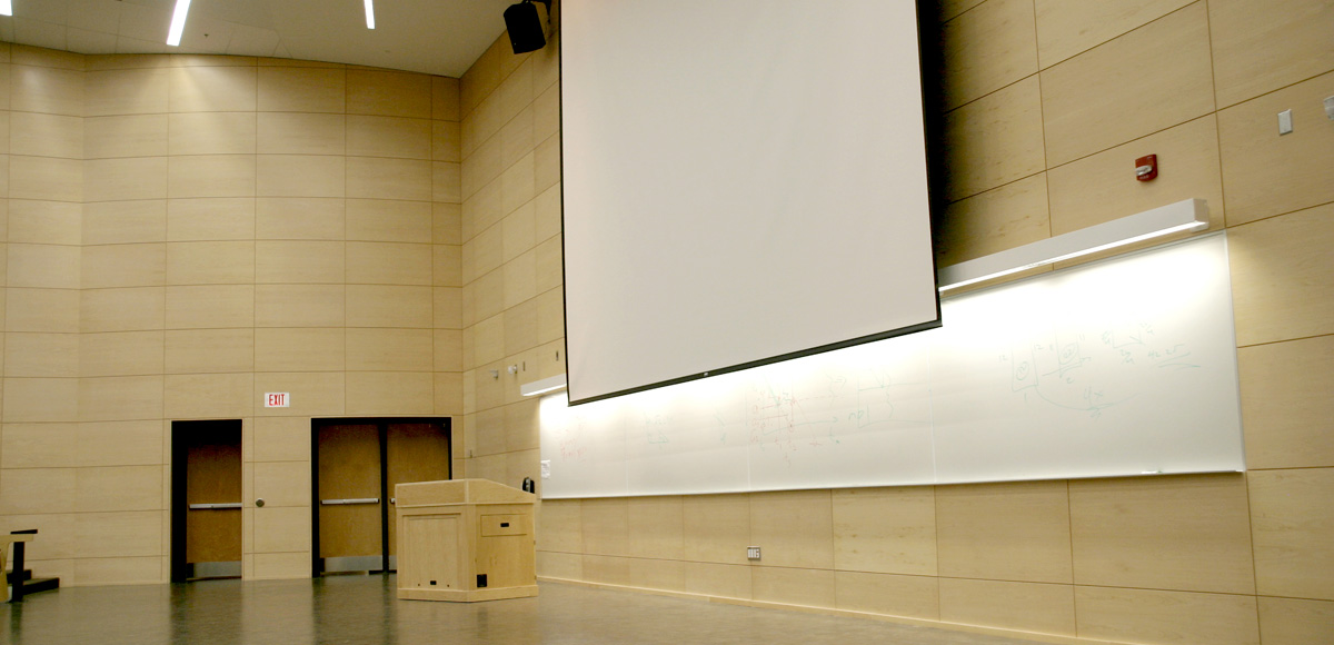 Podium and screen in the TRS 1-067 lecture hall