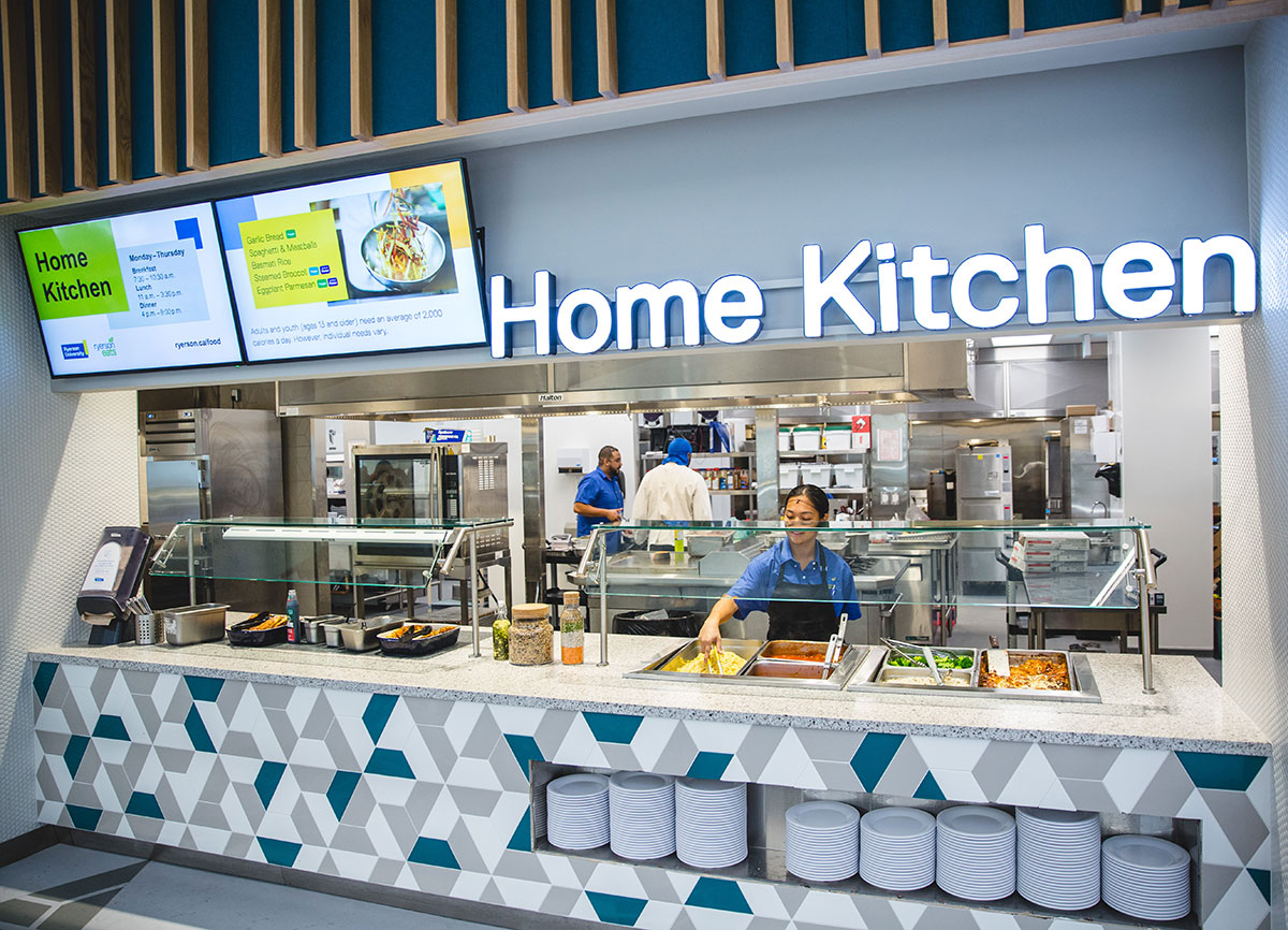 The bright food counter in the Pitman Dining Hall. The sign reads Home Kitchen. 