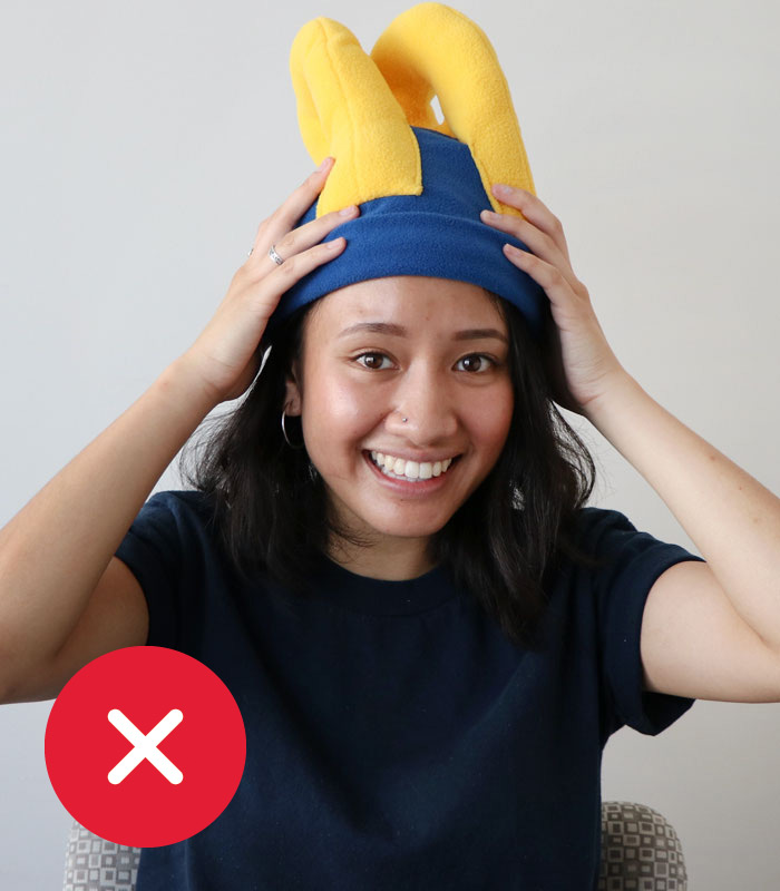 Unacceptable OneCard photo submission. Person wearing hat with ram's ears.