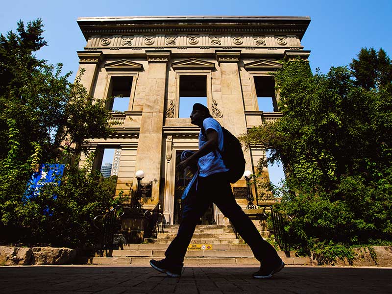 A student walking past the entrance to the RAC.