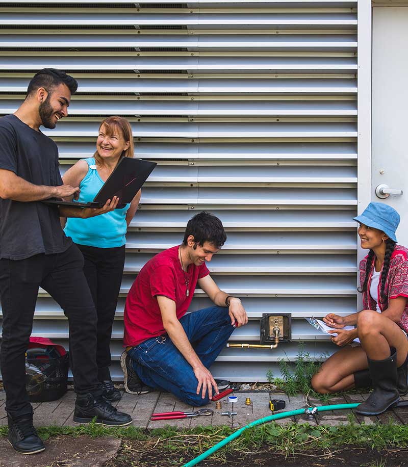 A group of people conducting resarch on the rooftop farm