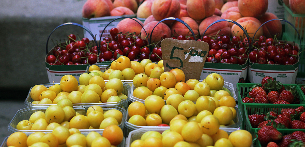 Plums, strawberries, cherries and peaches for sale at the Farmers' Market.