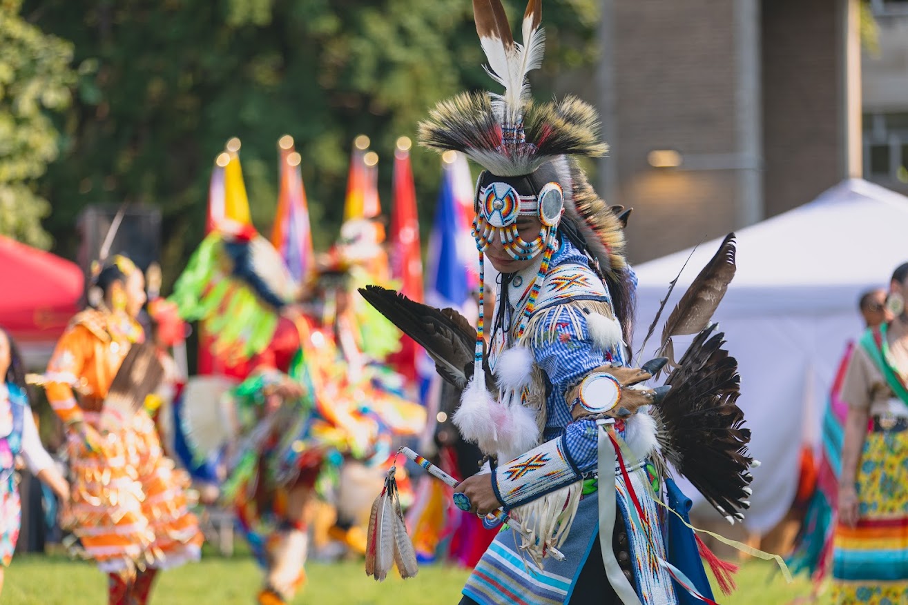Chicken pow wow dancer, dancing within the Pow Wow dance circle.