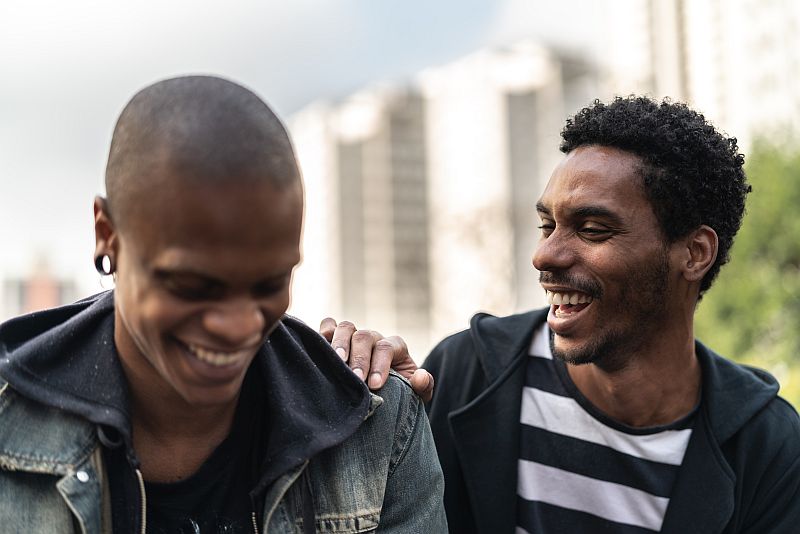 Two men talking in an urban setting