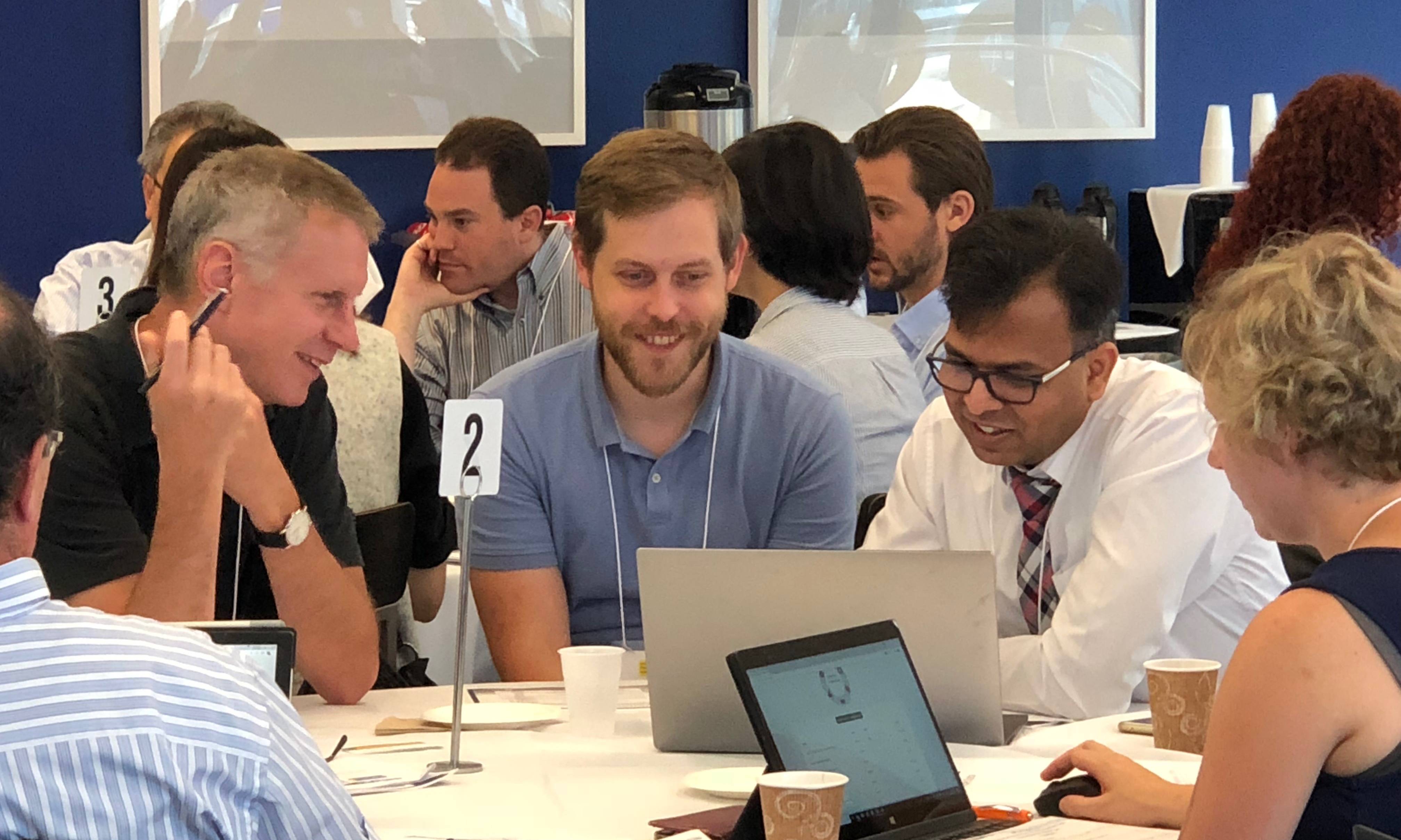 people collaborating around roundtable