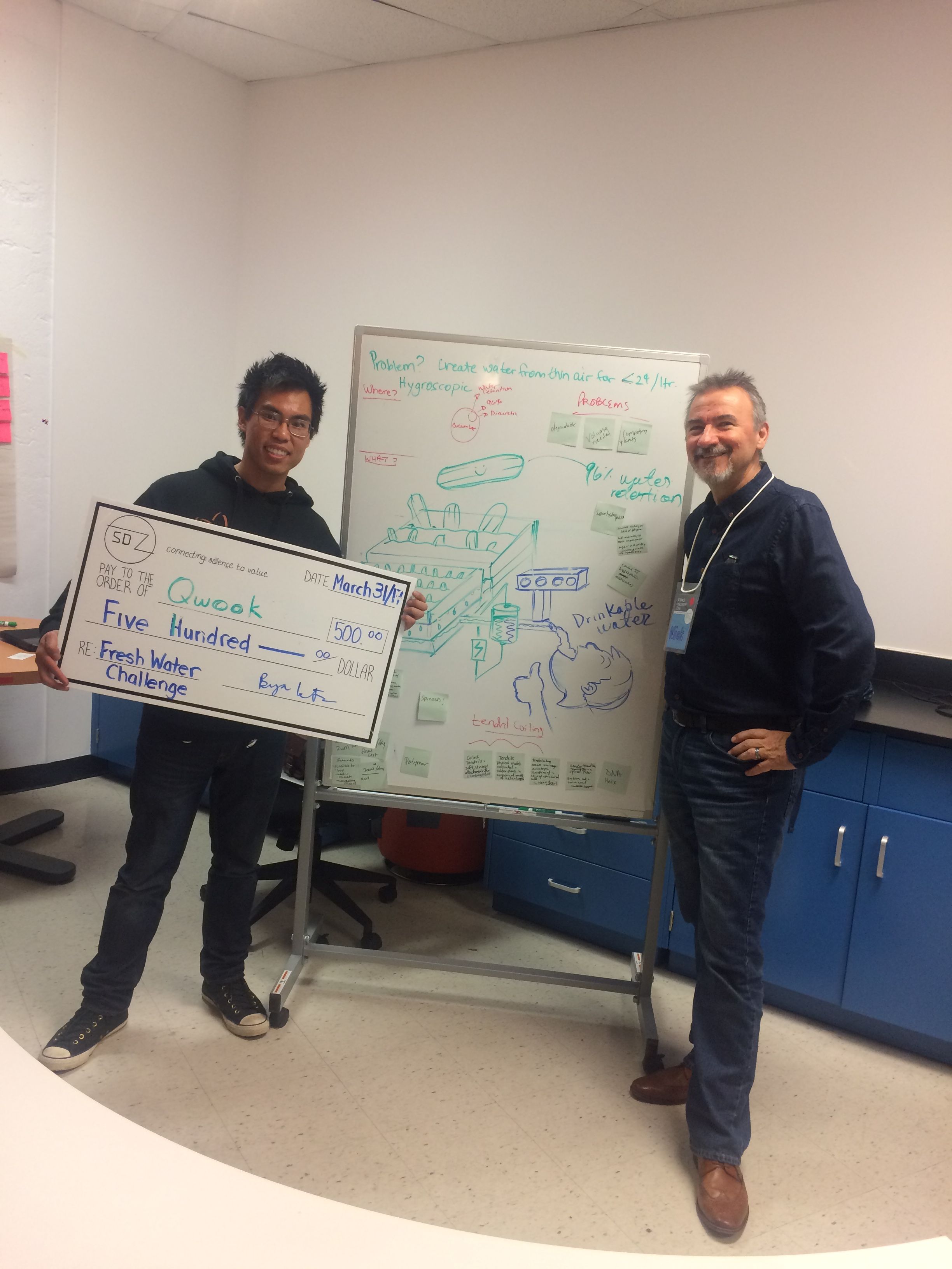 Nick presenting first place cheque to winning team