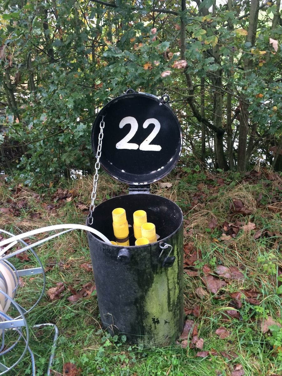 garbage can with '22' written under the lid
