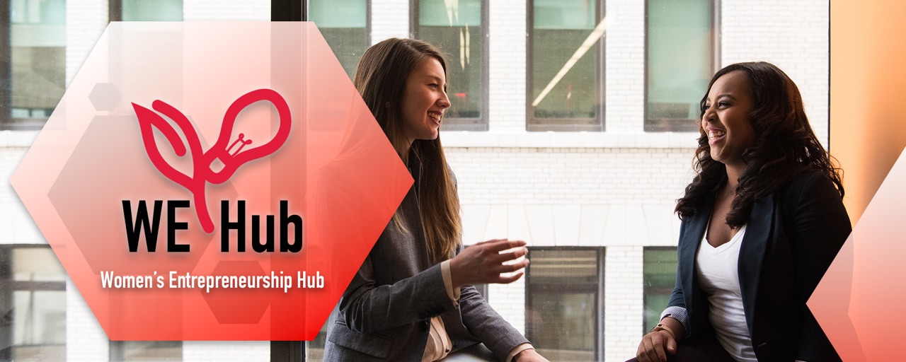 The WE-Hub logo atop a photo of two women talking and laughing.