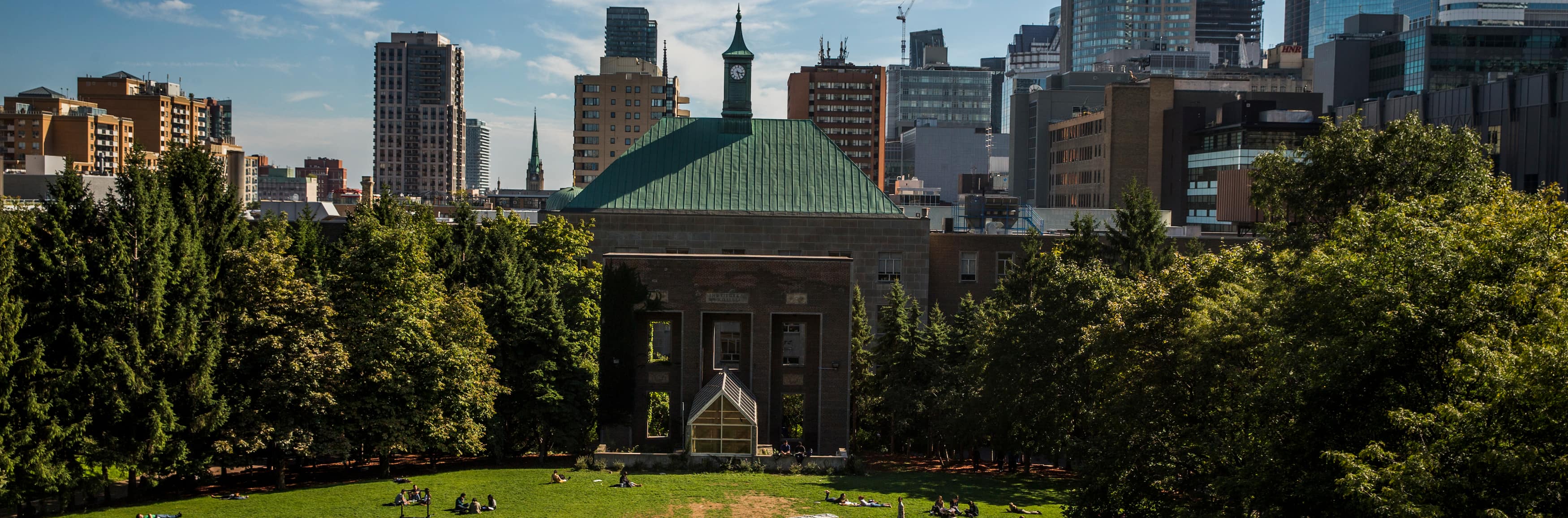 Bird’s eye view of students in TMU’s Quad with the Downtown Toronto cityscape in the background