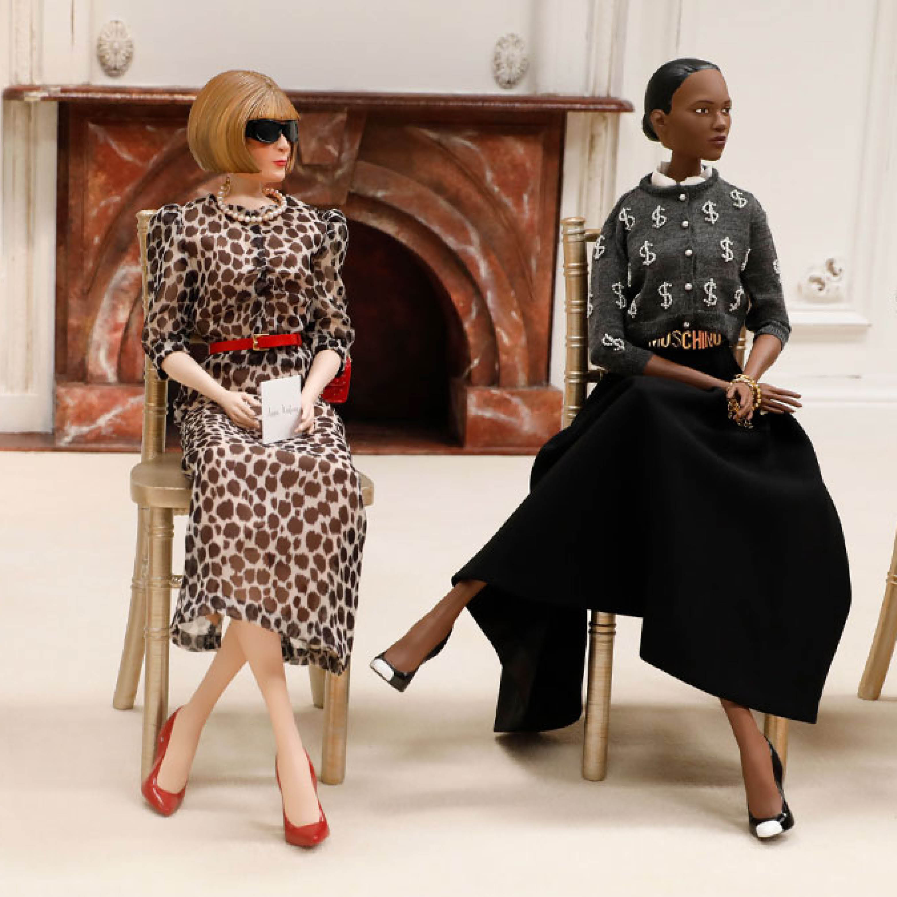 Moschino puppets overlooking the runway show.