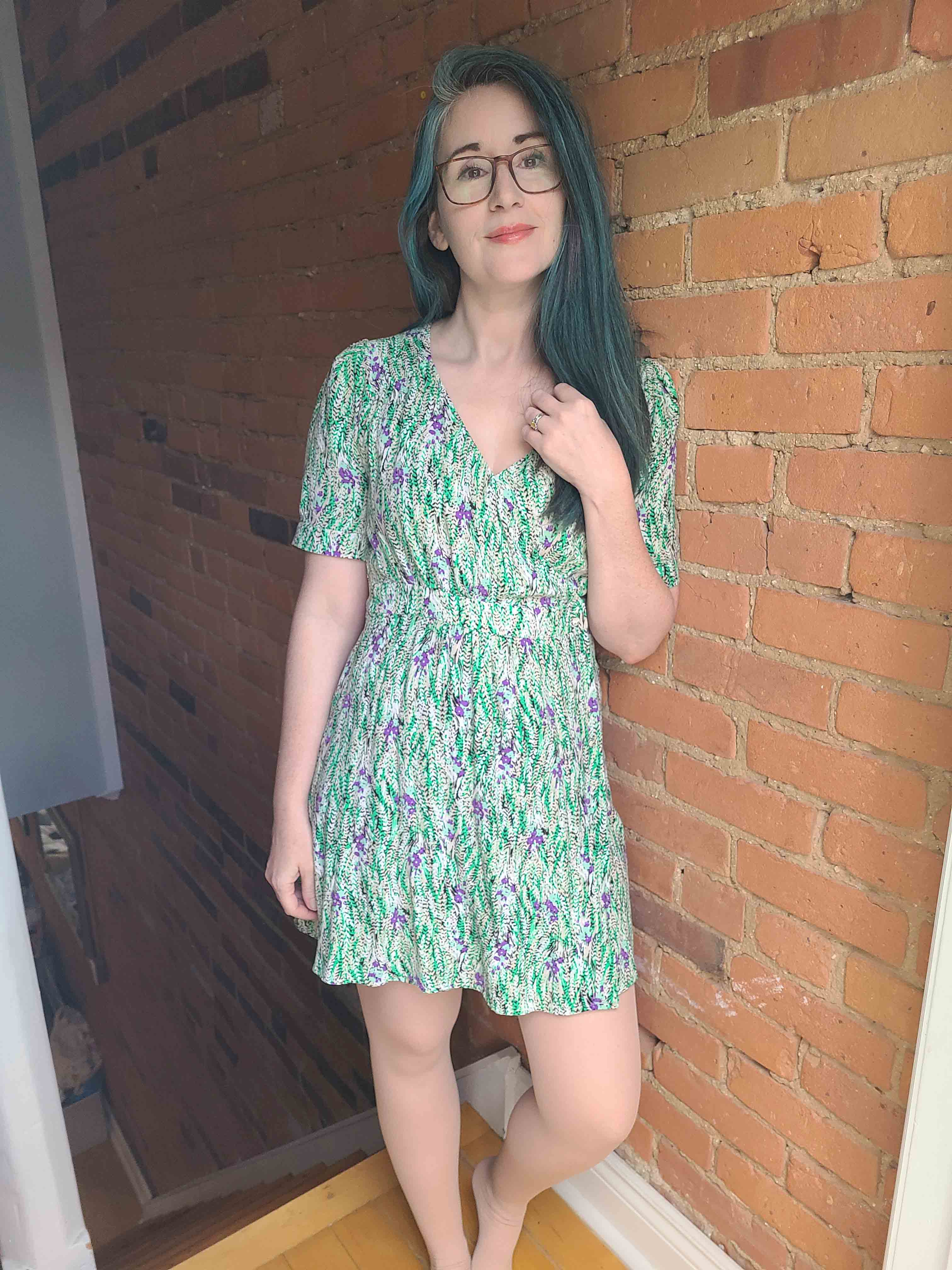 Sprout Outfit in front of colourful background.