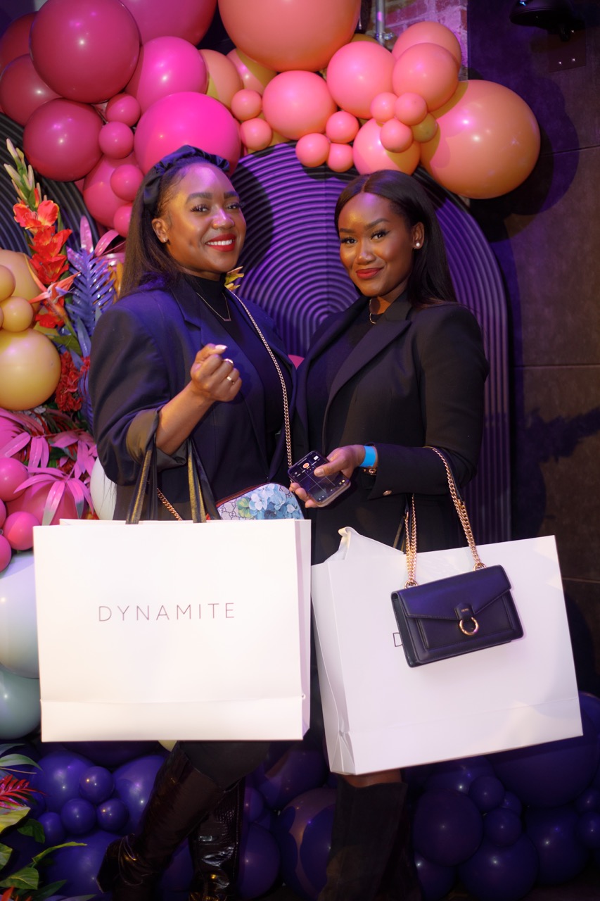 event photo holding shopping bags